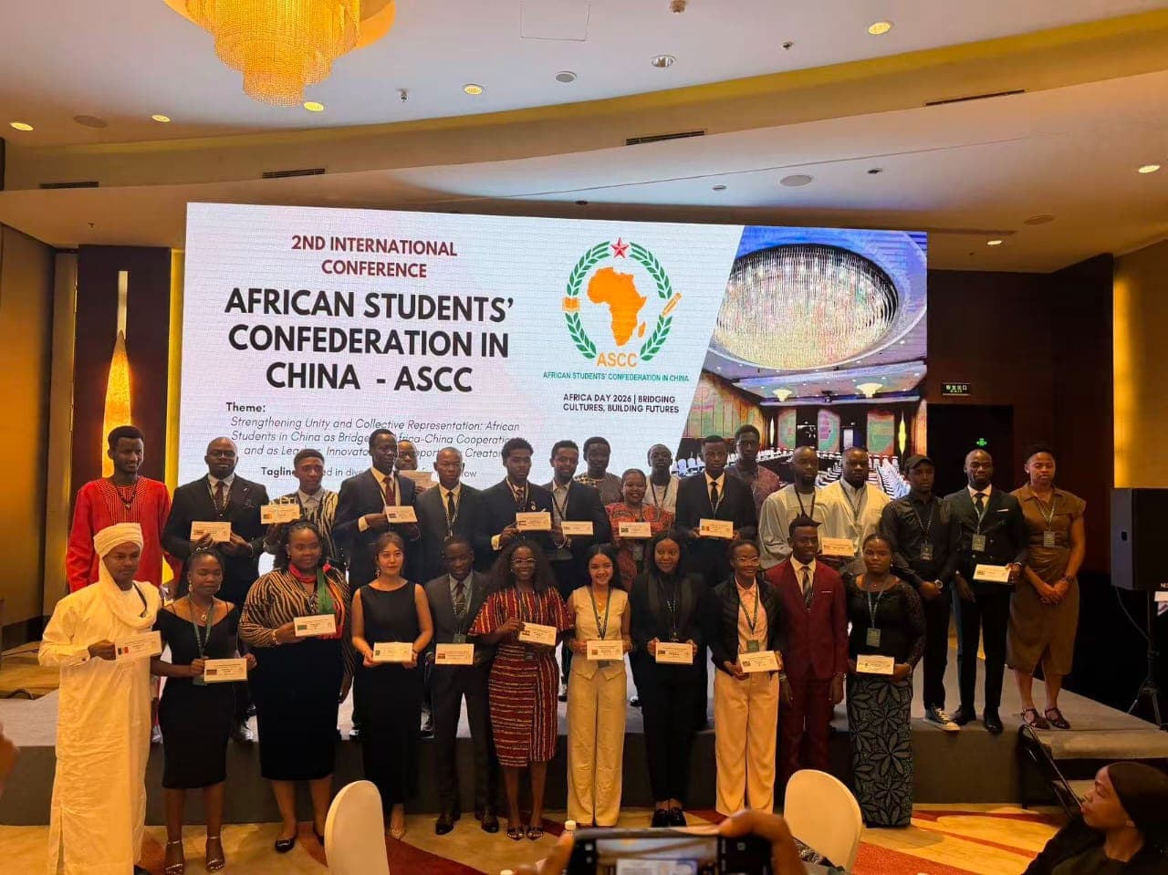 Participants displaying recognition certificates at the ASCC conference